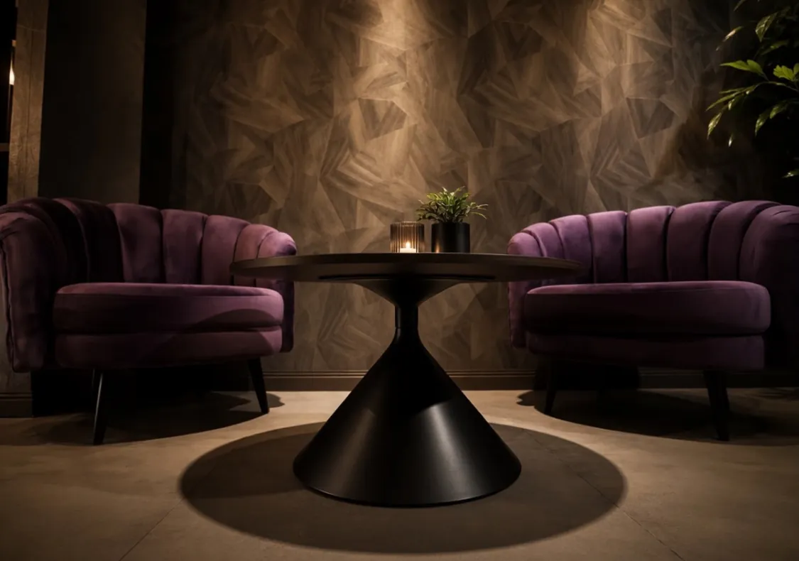 The Nuru House lobby, purple velvet armchairs and candlelight in a dark textured lounge